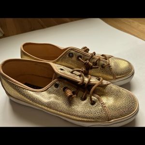 Gold Sperry shoes